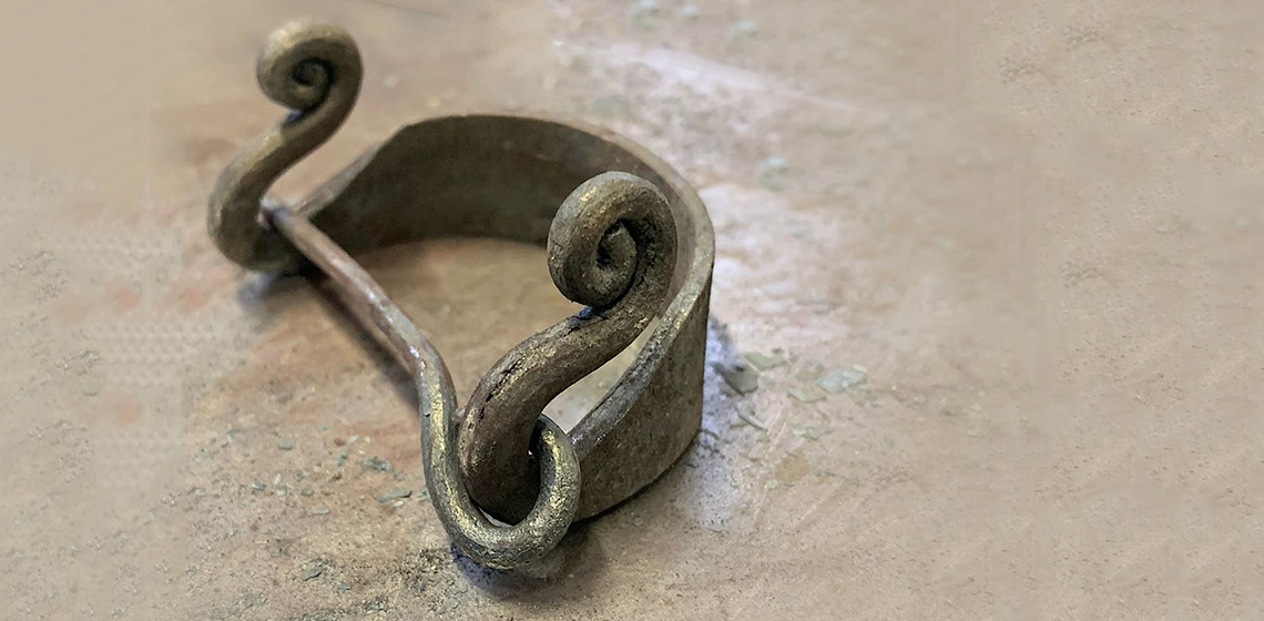 The Salme Ship Burials. The Salme II Ship Burial restored iron fibula no SM10602:325. Photo by Tiia Lahti